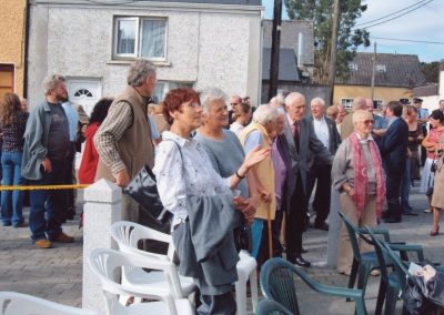 A crowd gathered in a housing estate